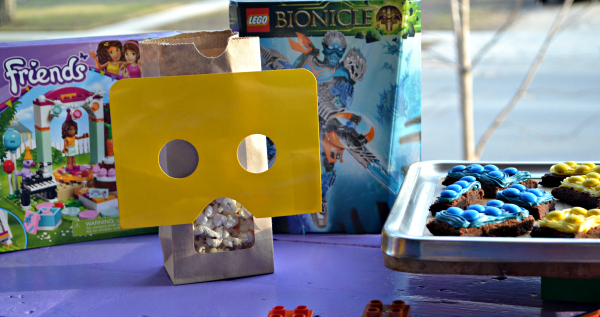 Simple LEGO Party on a budget. Lego figure popcorn bags, Lego brick brownies, and banner. 