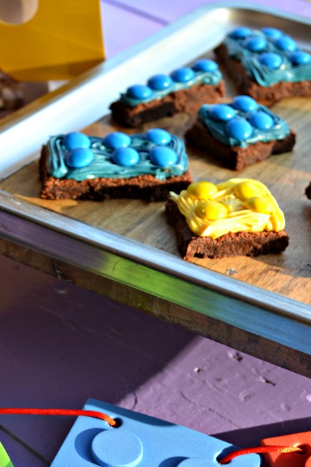 Simple LEGO Party on a budget. Lego figure popcorn bags, Lego brick brownies, and banner. 