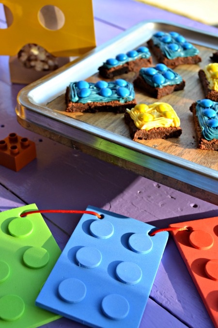 Simple LEGO Party on a budget. Lego figure popcorn bags, Lego brick brownies, and banner. 