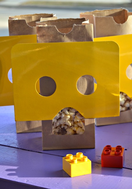 Simple LEGO Party on a budget. Lego figure popcorn bags, Lego brick brownies, and banner. 