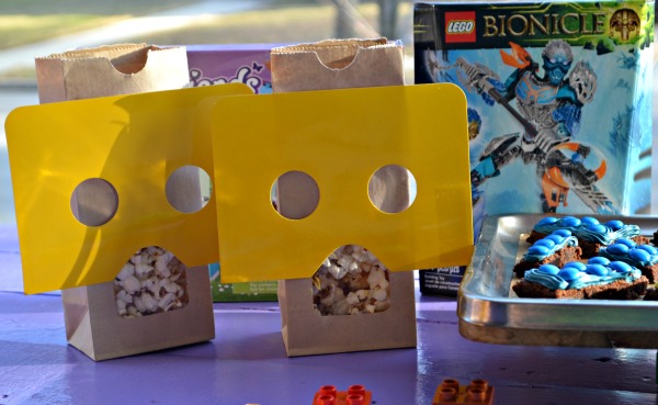 Simple LEGO Party on a budget. Lego figure popcorn bags, Lego brick brownies, and banner. 