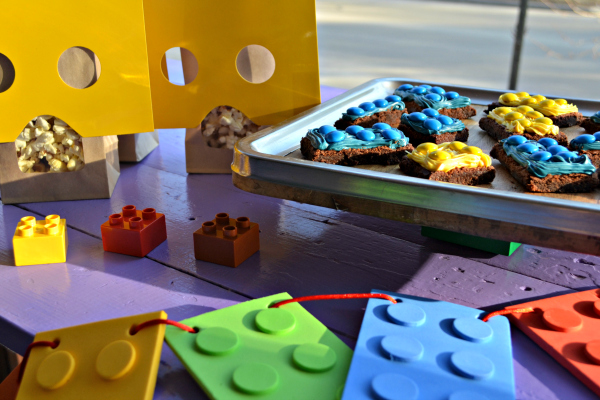 Simple LEGO Party on a budget. Lego figure popcorn bags, Lego brick brownies, and banner. 