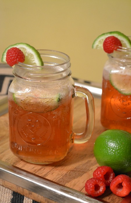 Raspberry moscow mule drink recipe, with fresh raspberries and lime.