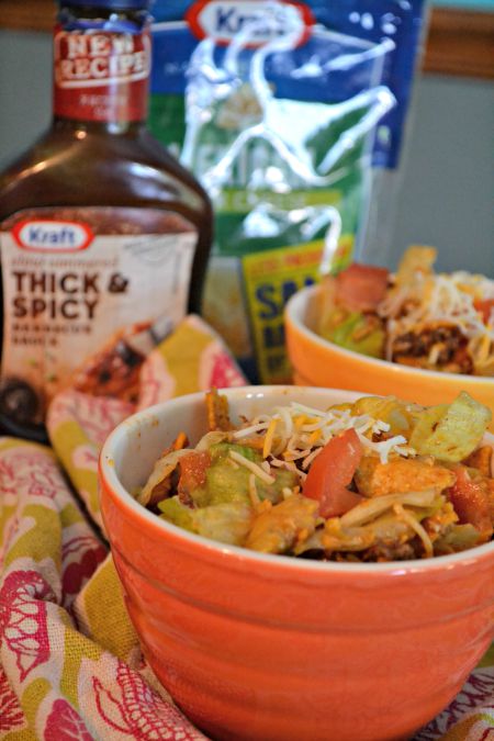 Doritos and BBQ Tex Mex Party Salad recipe. Your favorite chips mixed with taco meat and your favorite taco toppings and barbeque sauce. This is the best side dish for Summer parties. 