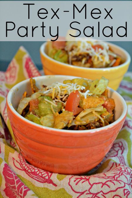 Doritos and BBQ Tex Mex Party Salad recipe. Your favorite chips mixed with taco meat and your favorite taco toppings and barbeque sauce. This is the best side dish for Summer parties. 